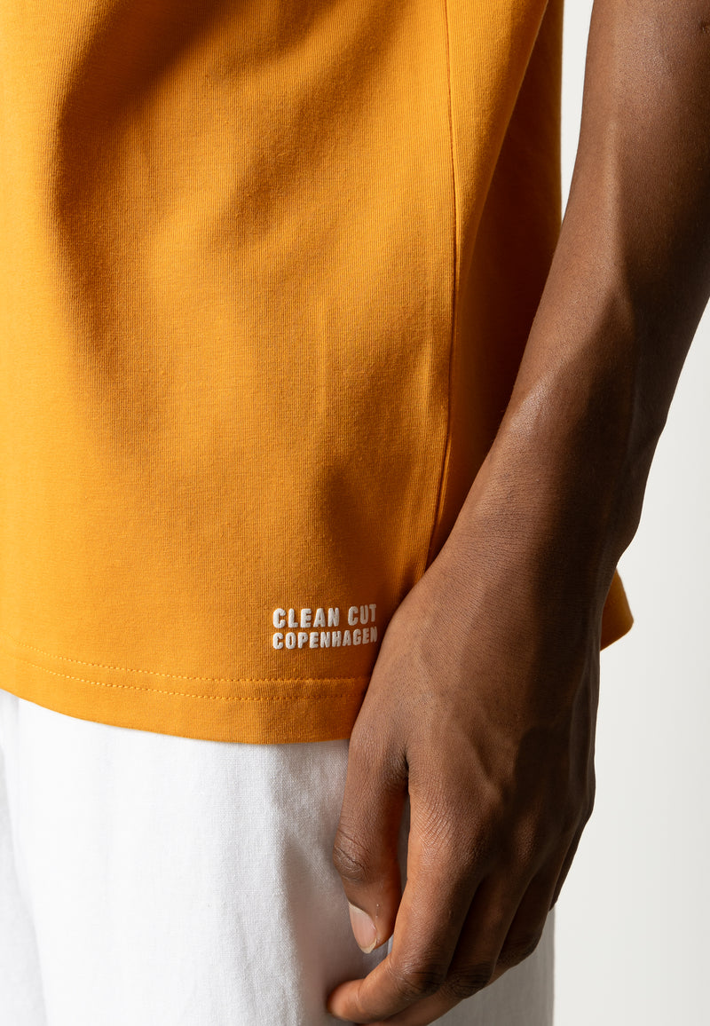 Clean Cut Copenhagen Cross organic logo t-shirt T-shirts S/S Orange